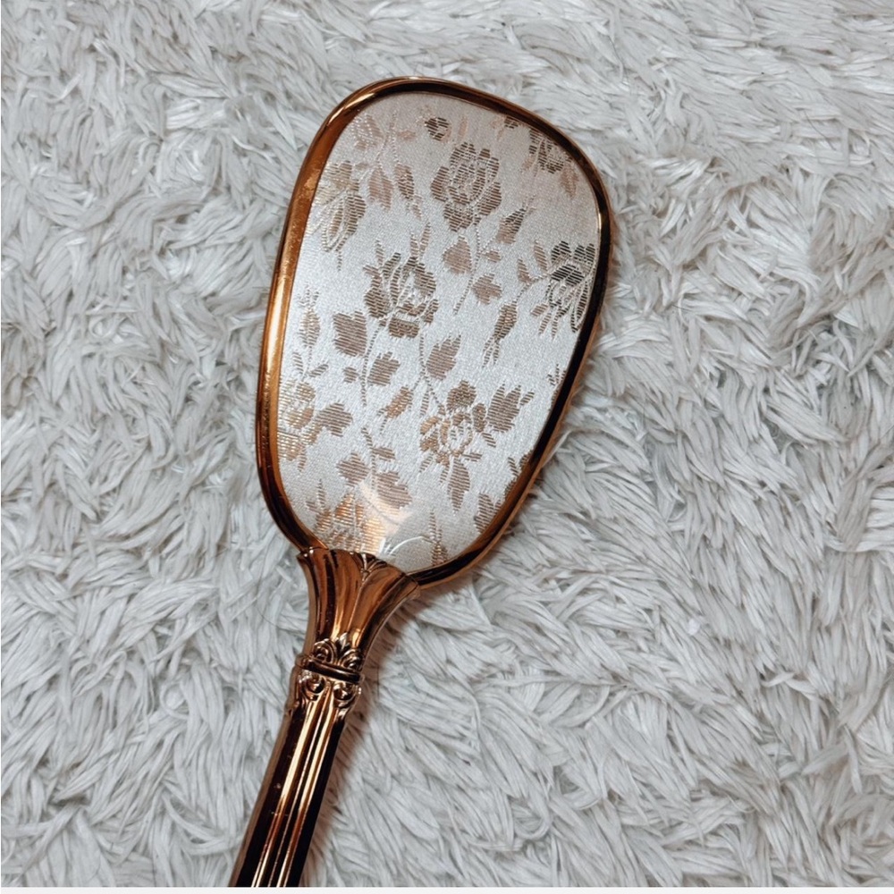Elegant Gold Hand Mirror with Floral Design